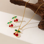 Collier pendentif et boucles d'oreilles  cerise en strass